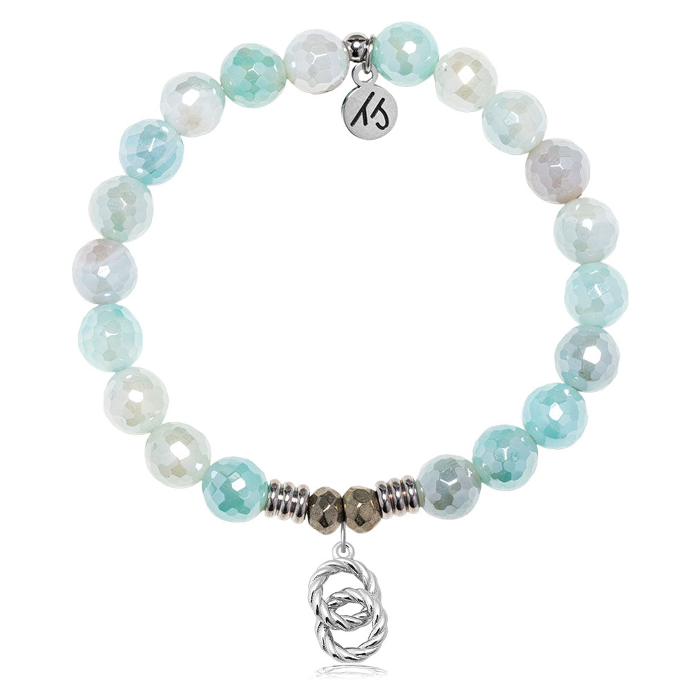The T Jazelle Aqua Agate Gemstone Bracelet features faceted light blue and white beads, silver accents, a sterling silver "Forever Connected" charm, and a small silver knot pendant at the center.