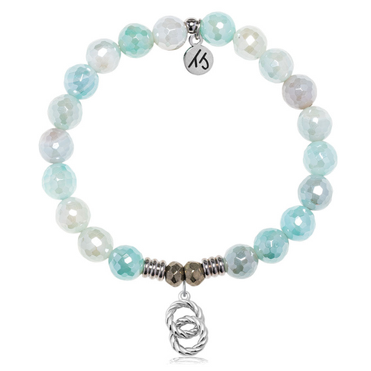 The T Jazelle Aqua Agate Gemstone Bracelet features faceted light blue and white beads, silver accents, a sterling silver "Forever Connected" charm, and a small silver knot pendant at the center.