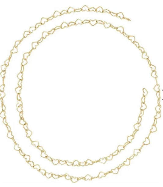 On a white background, the 14KY Heart Chain by Stuller-Stuller elegantly spirals with its intricate 3.2mm design, featuring small, evenly spaced hearts.