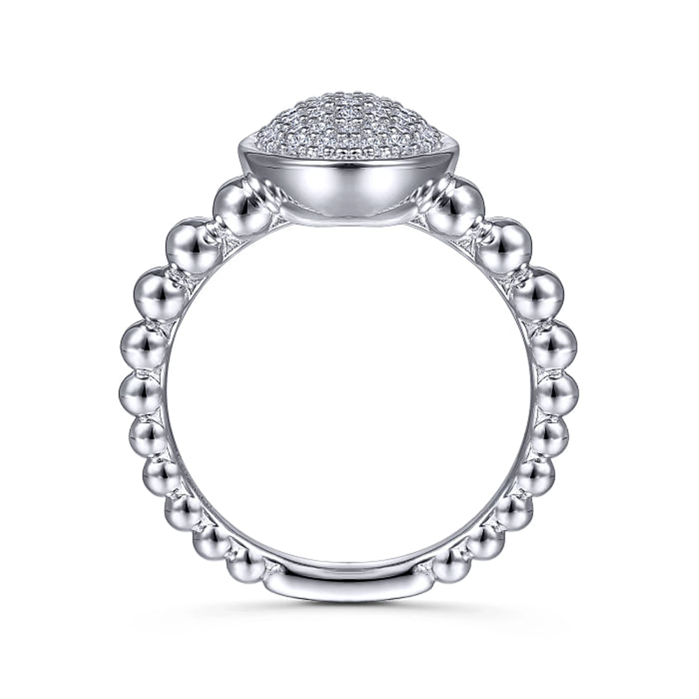 A sterling silver oval signet ring from Gabriel & Co's Bujuk Collection features a beaded band and a raised, dome-shaped top encrusted with dazzling white sapphire pavé. The beads encircle the entire band, adding an intricate, elegant touch to the overall design.