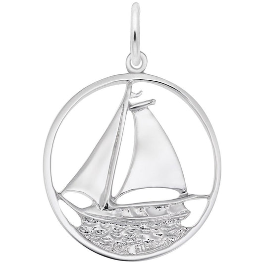 The Rembrandt Charms Sailboat Charm in sterling silver features a meticulously detailed sailboat with two sails, enclosed within a circular frame. The charm artfully captures the sailboat on textured waves, evoking a nautical theme. A loop at the top makes it easy to attach to a chain, making it an ideal piece of sailboat jewelry.