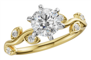 The Allison Kaufman 14k two-tone semi-set leaf engagement ring showcases a large, round 2ct diamond in a six-prong setting. The band features an elegant twisted design with delicate leaf-shaped accents adorned with small diamonds on each side.