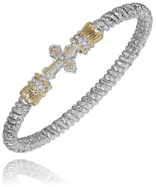 This Alwand Vahan Jewelry bracelet, crafted from sterling silver and 14k gold, boasts an intricate chain design. The centerpiece features a gold-toned cross adorned with small clear stones and bejeweled accents on either side. With a diamond weight of 0.08 carats and a band width of 4mm, this stunning piece sparkles elegantly.