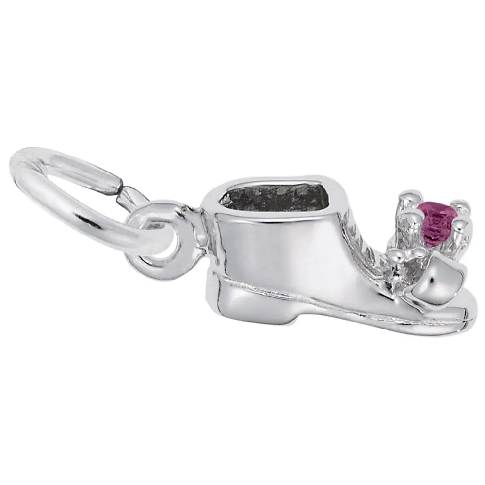 The July Baby Bootie Charm from Rembrandt Charms is a sterling silver baby shoe pendant, featuring detailed stitching and a small, pink gemstone embedded at the toe. This charm also includes a circular loop for easy attachment to a necklace or bracelet.