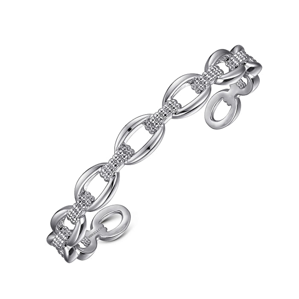 The 925 Sterling Silver Oval Link Cuff from Gabriel & Co's Bujukan Collection features an elegant linked design with alternating elongated oval shapes and smaller circular links. Accented with small sparkling stones, this cuff showcases delicate and sophisticated craftsmanship in 925 Sterling Silver.