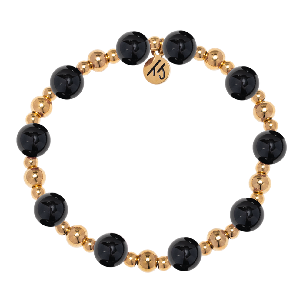 The Gold Day by Day Collection-Onyx Gemstone Bracelet by T Jazelle features alternating large black onyx and small gold beads plus a round gold "MS" charm—a stylish piece from the Day by Day Brace line.