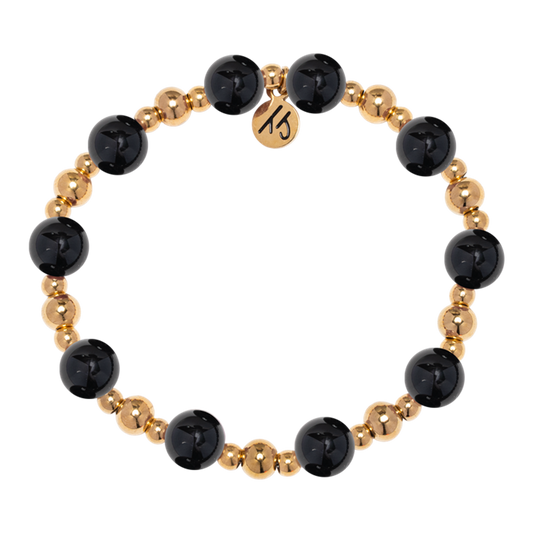The Gold Day by Day Collection-Onyx Gemstone Bracelet by T Jazelle features alternating large black onyx and small gold beads plus a round gold "MS" charm—a stylish piece from the Day by Day Brace line.