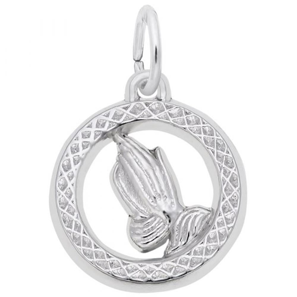 The Praying Hands Charm by Rembrandt Charms features a pair of praying hands in sterling silver, encased in a circular, textured border with a small loop at the top for easy attachment to a chain or bracelet. This elegant piece is showcased against a plain white background.