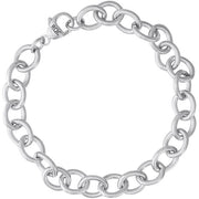 The Charm Bracelet by Rembrandt Charms is an 8-inch sterling silver piece with interlocking round links and a lobster clasp fastener marked "RCO." Its simple yet elegant design makes it suitable for both casual and formal wear.