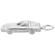 The Rembrandt Charms Late Model American Sports Car Charm in sterling silver features detailed elements such as wheels, headlights, and an aerodynamic design. Resembling a classic convertible, it makes the perfect accessory for any classic car enthusiast. It also includes a small loop for easy attachment.