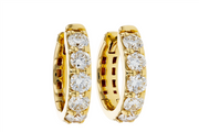 The Allison Kaufman ER819-1 14K YG 1ct Diamond Huggies, each set with five round white diamonds, are displayed against a white background.