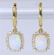 A pair of Bellarri's Opal and Diamond Earrings from the Forever Young Collection, featuring 1.76ct rectangular iridescent opals framed by 0.29ct small diamonds, set in 14K yellow gold. These stunning earrings are displayed against a plain, light-colored background.
