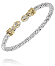 A 3 mm band sterling silver bracelet by Alwand Vahan Jewelry featuring a textured, woven design accented with 14k gold elements. The bracelet is showcased against a transparent background, emphasizing its intricate details and impressive craftsmanship. Note: This piece contains no diamond weight.