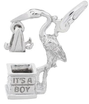 The "It's A Boy Stork" charm by Rembrandt Charms is a sterling silver piece depicting a stork in flight with open wings, carrying a baby cradle. The base is engraved with the text "IT'S A BOY," capturing intricate details of the stork's posture and texture. This charm adds timeless elegance to any jewelry collection.