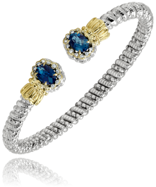 Alwand Vahan Jewelry presents the "4mm London Blue," a silver beaded bracelet adorned with 4mm London blue gemstone ends accentuated by gold highlights. This bracelet features an open-ended, textured design.
