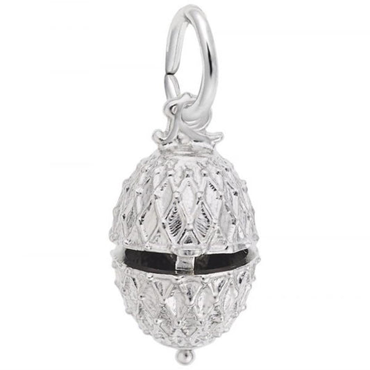 A detailed, silver egg-shaped pendant with a crisscross pattern and a black band around its middle, hangs from a small loop at the top. The intricate design gives this charming Rembrandt Charms' Easter Egg With Chick Charm in sterling silver a textured appearance.