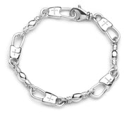 The Denali Pro Jewelers 'Fisher of Men' bracelet showcases a stylish design with a linked chain, each 8.25" link alternating between a shiny smooth surface and an engraved cross symbol. The 9mm width bracelet is secured with a XL Cross Snap clasp closure, providing both style and security.