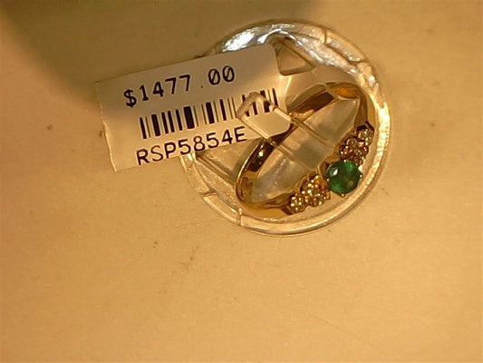 The Ryan Gems Small Round Emerald and Diamond ring, crafted in 14k yellow gold (size 7.5), is displayed on a round stand with a $1477.00 price tag and code RSP5854E.