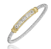 This image showcases the Diamond Swirls Bracelet 4mm Vahan by Alwand Vahan Jewelry, which features an intricate design. The main part of the bracelet is crafted from Sterling Silver with a woven or twisted appearance. At the center is a detailed 14k Gold bar adorned with elaborate scrollwork, flanked by gold decorative caps on each side.