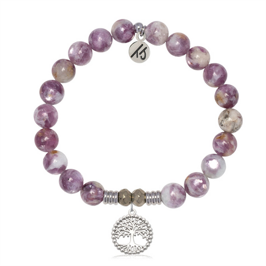 The T Jazelle Lepidolite Quartz Gemstone Bracelet features round purple and white stones, a family tree sterling silver charm, and a small engraved circular metal tag.