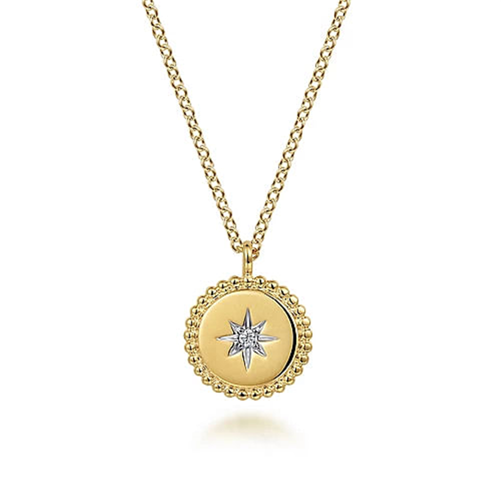This exquisite 14K Yellow Gold Bujukan Medallion Necklace from Gabriel & Co features a circular pendant adorned with a raised border and a Starburst Diamond Center, elegantly suspended from a gold chain composed of interlinked oval-shaped links.