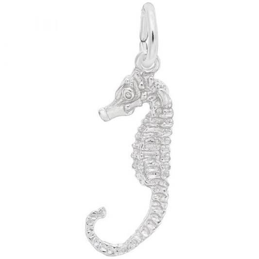 The Rembrandt Charms Seahorse Charm in Sterling Silver features a textured body and hangs from a small ring. This intricately designed charm captures the essence of the marine creature with its curled tail, ridged back, and prominent snout, all brought to life in a shiny metallic finish.