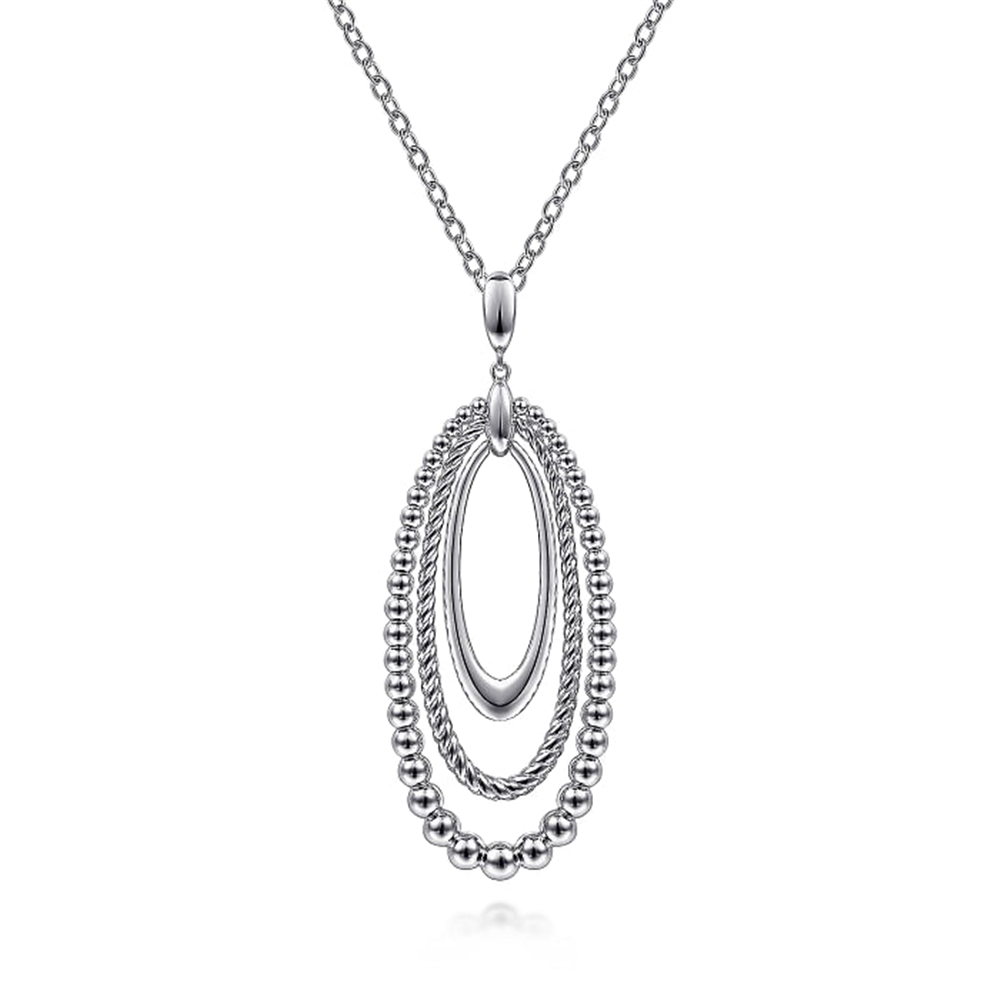 Gabriel & Co's 925 Sterling Silver Bujukan and Rope Circle Pendant Necklace from the Bujukan Collection features a stunning pendant with three nested oval loops: the innermost is plain, the middle is textured, and the outermost loop is adorned with small beads. Crafted from 925 Sterling Silver, the pendant hangs elegantly from a delicate silver chain.