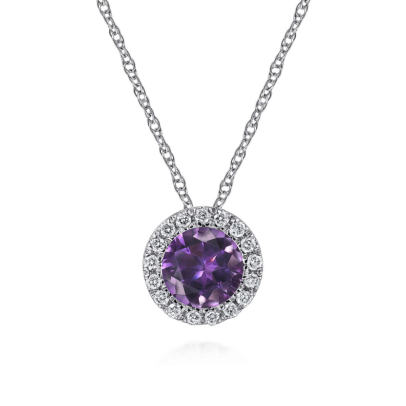 The Gabriel & Co 14K White Gold Amethyst and Diamond Halo Pendant Necklace features a round amethyst encircled by sparkling diamonds, elegantly presented on a white background.