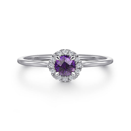 The Gabriel & Co 14K Amethyst and Diamond Halo Ring (size 6.5, SN: S2079308) features a round amethyst center, encircled by sparkling diamonds, shown on a plain white background.