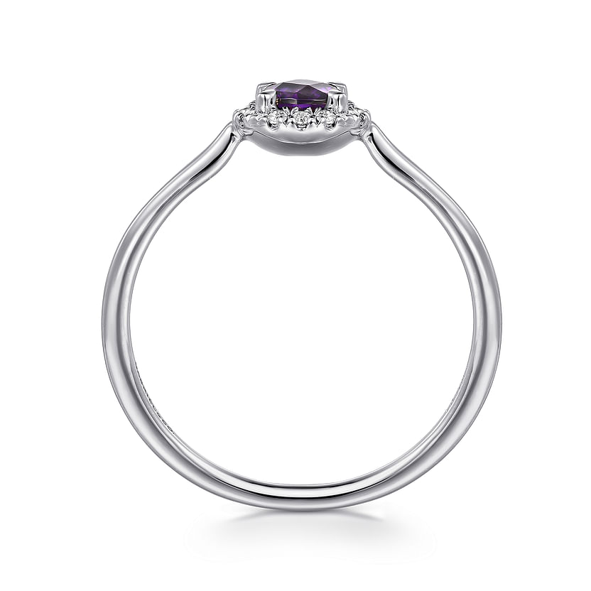 The Gabriel & Co 14K White Gold Amethyst and Diamond Halo Ring showcases a round purple amethyst center, encircled by a diamond halo on a slim, polished band.
