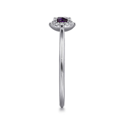 Side view of the Gabriel & Co 14K White Gold Amethyst and Diamond Halo Ring, showcasing a thin band, central amethyst gemstone, and sparkling diamond halo setting.