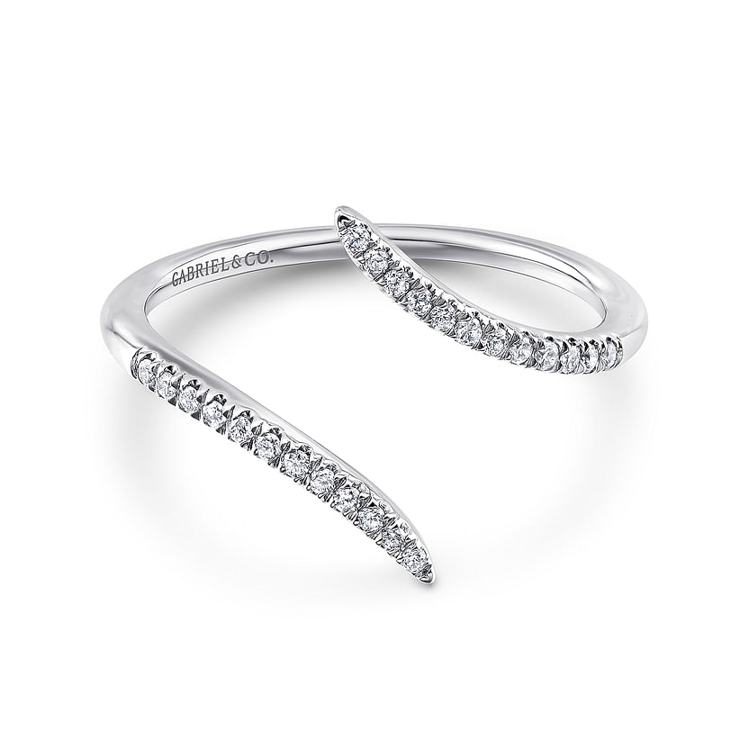 The 14K White Gold Bypass Open Diamond Ring by Gabriel & Co features two tapered, diamond-accented ends in a modern open design, with "Gabriel & Co." engraved inside.