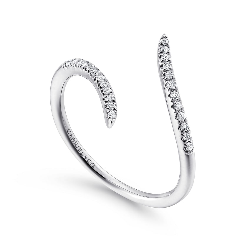 The Gabriel & Co 14K White Gold Bypass Open Diamond Ring features two tapered, diamond-encrusted ends and a sleek, modern design. This minimalist band is from the Kaslique Collection and engraved inside with "CARAT & CO".