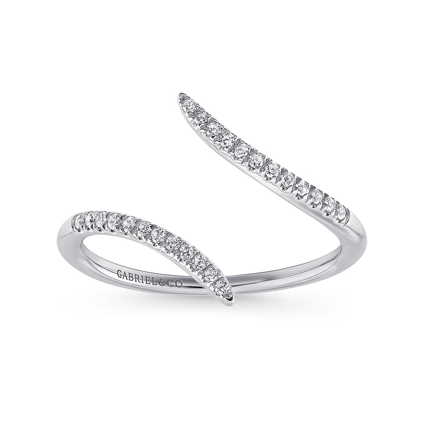 The 14K White Gold Bypass Open Diamond Ring by Gabriel & Co features two tapered, diamond-encrusted ends in a sleek, curved design from the Kaslique Collection, with "GABRIEL & CO." inscribed inside.