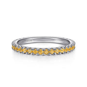 The 14K White Gold Citrine Stackable Ring by Gabriel & Co features a row of small, round yellow citrines—November’s birthstone—set along the top, with "GABRIEL & CO." engraved inside. Perfect for stacking or wearing alone.