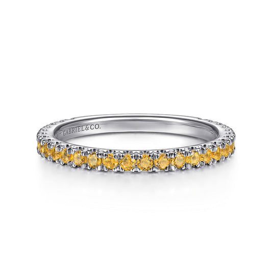 The 14K White Gold Citrine Stackable Ring by Gabriel & Co features a row of small, round yellow citrines—November’s birthstone—set along the top, with "GABRIEL & CO." engraved inside. Perfect for stacking or wearing alone.