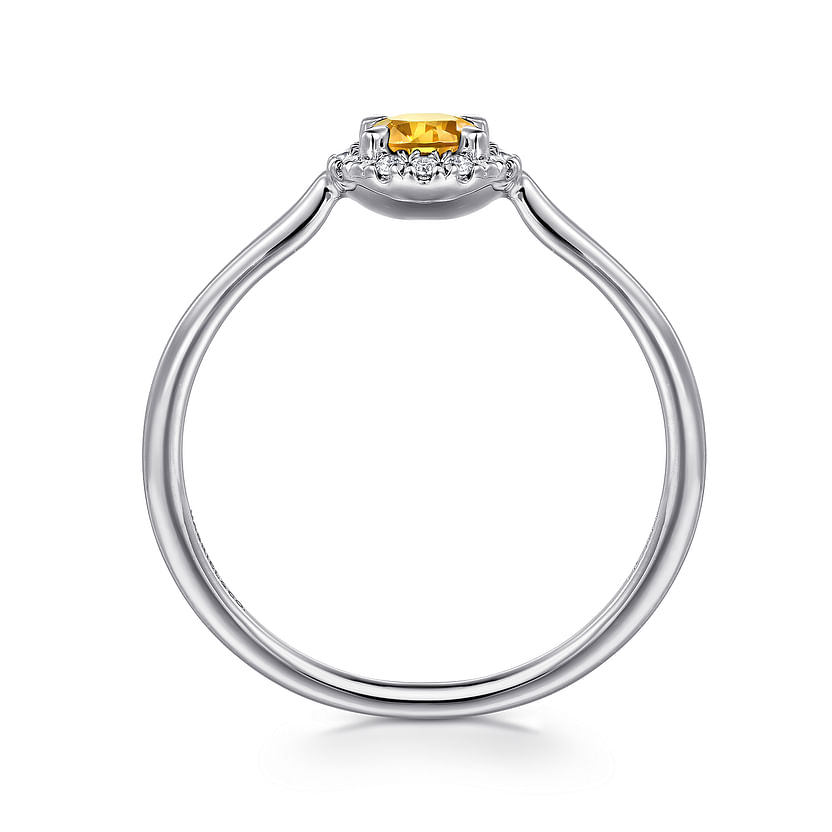 Side view of the Gabriel & Co 14K White Gold Citrine and Diamond Halo Promise Ring, showcasing a round yellow citrine in a claw setting with a diamond halo and a sleek band that accentuates the vibrant center stone.