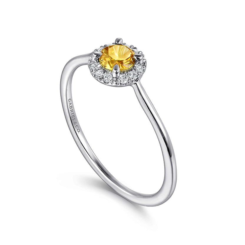 The Gabriel & Co 14K White Gold Citrine and Diamond Halo Promise Ring features a round yellow citrine and sparkling diamond halo on a slim white gold band.