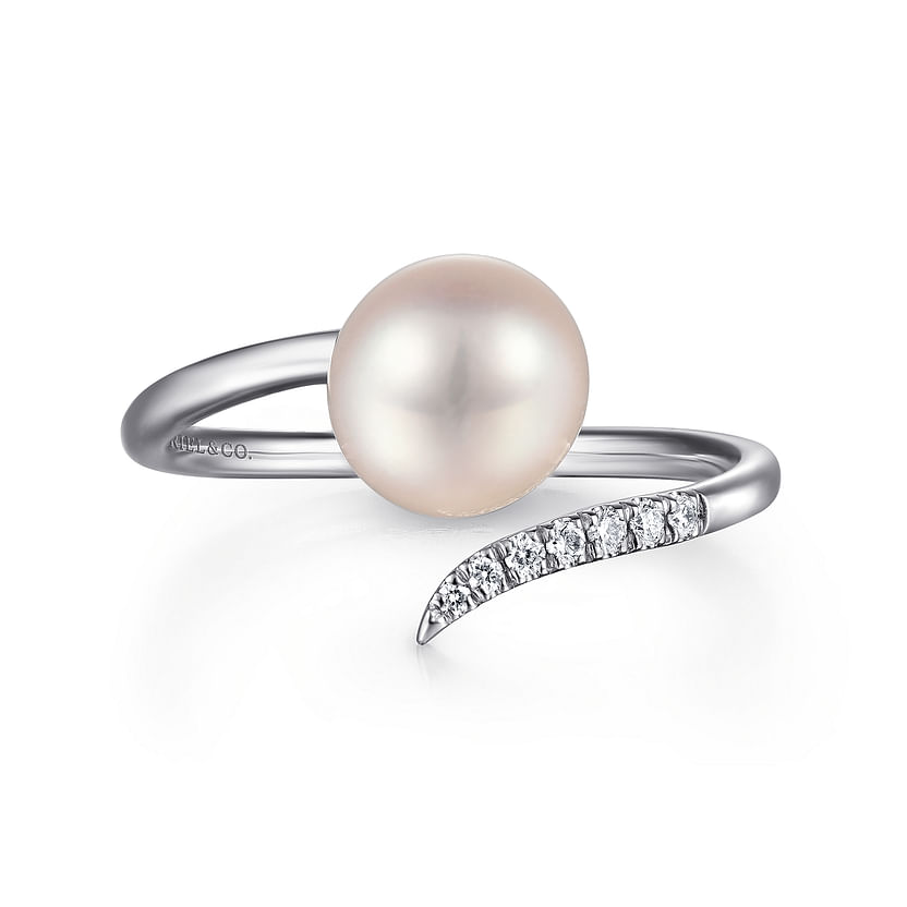 The Gabriel & Co 14K White Gold Cultured Pearl and Diamond Open Wrap Ring features a large central pearl and a tapered band with small diamonds on one end, displayed against a plain white background.