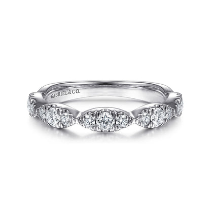The 14K White Gold Diamond Cluster Marquis Station Ring by Gabriel & Co features round-cut diamonds in a vintage-inspired, stackable design, with "Gabriel & Co." engraved inside the band.