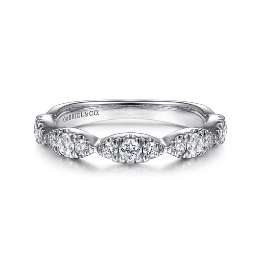 The 14K White Gold Diamond Cluster Marquis Station Ring by Gabriel & Co features round-cut diamonds in a vintage-inspired, stackable design, with "Gabriel & Co." engraved inside the band.