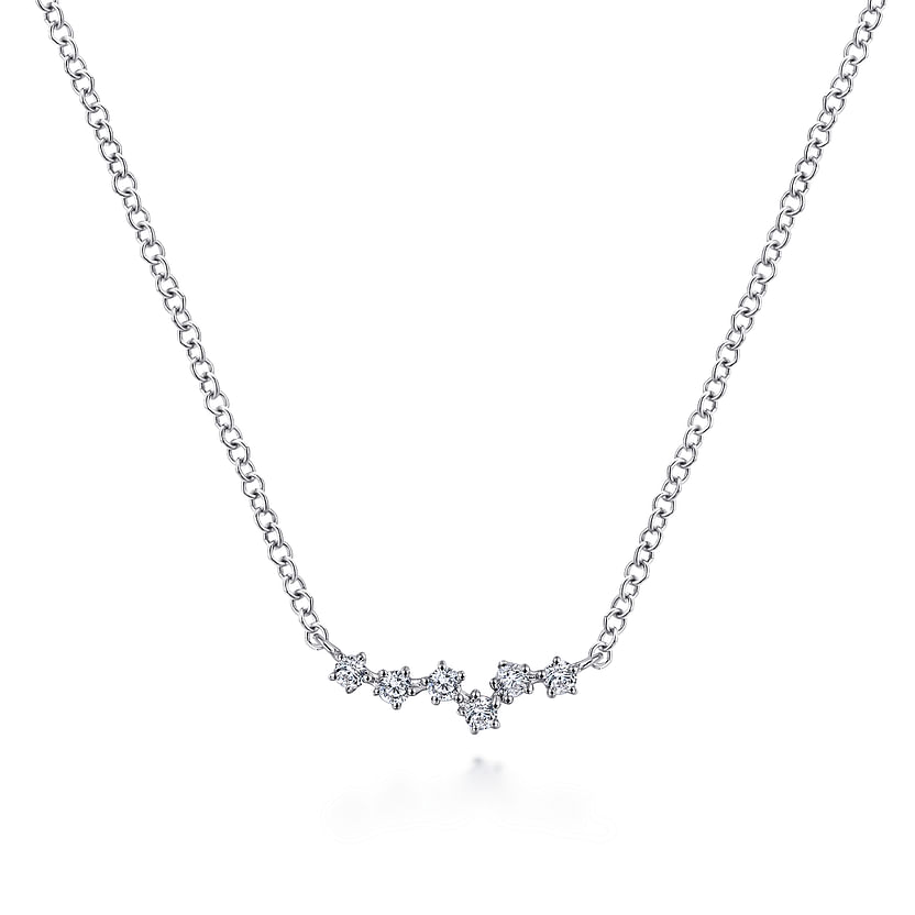 The Gabriel & Co 14K White Gold Diamond Constellation Bar Necklace features a cluster of star-shaped pendants with sparkling diamonds, gently curved at the center, shown against a plain white background.