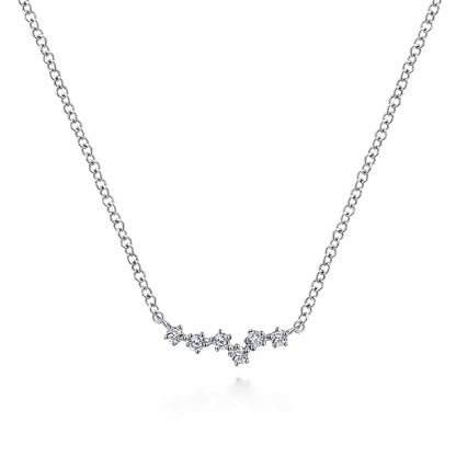 The Gabriel & Co 14K White Gold Diamond Constellation Bar Necklace features a cluster of star-shaped pendants with sparkling diamonds, gently curved at the center, shown against a plain white background.