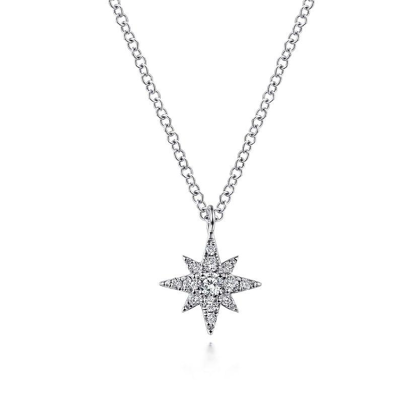 The Gabriel & Co 14K White Gold Diamond Pave Starburst Pendant Necklace features a dazzling starburst design with sparkling diamonds, presented on a delicate white gold chain against a plain white background.
