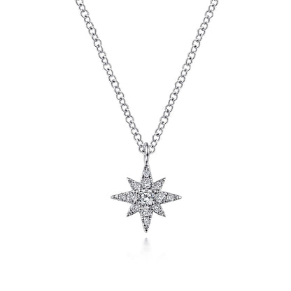 The Gabriel & Co 14K White Gold Diamond Pave Starburst Pendant Necklace features a dazzling starburst design with sparkling diamonds, presented on a delicate white gold chain against a plain white background.