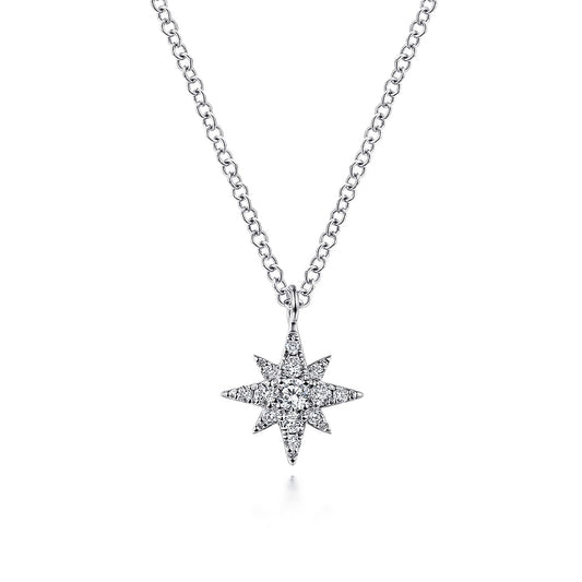 The Gabriel & Co 14K White Gold Diamond Pave Starburst Pendant Necklace features a dazzling starburst design with sparkling diamonds, presented on a delicate white gold chain against a plain white background.