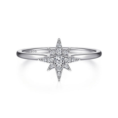 The Gabriel & Co 14K White Gold Diamond Starburst Ring features a central round diamond with a celestial-inspired starburst design accented by smaller diamonds, elegantly displayed against a white background.