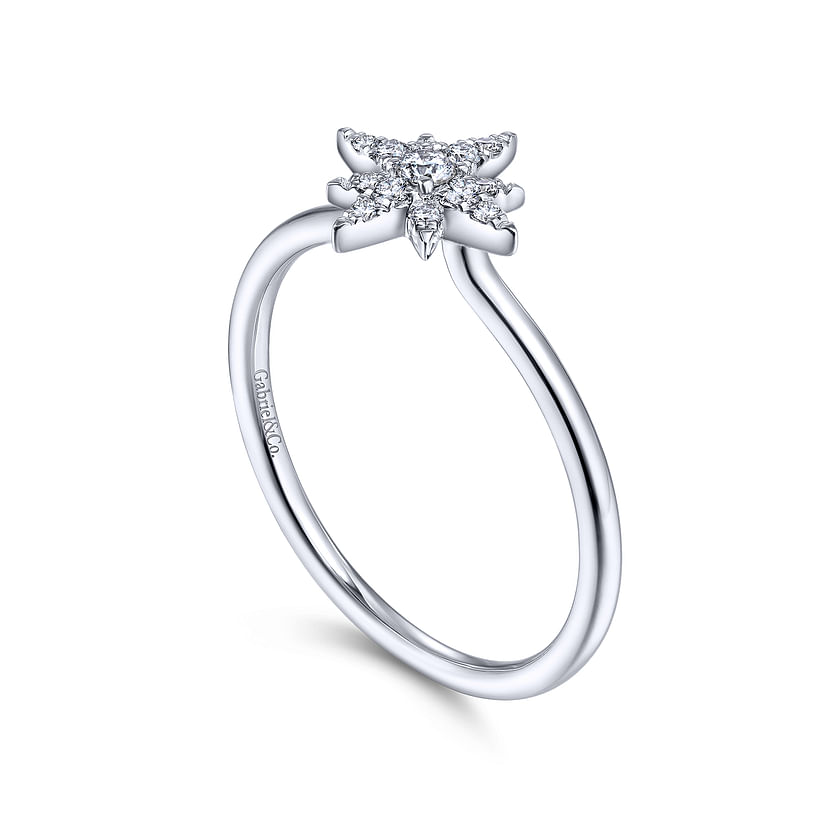 The Gabriel & Co 14K White Gold Diamond Starburst Ring features a star-shaped diamond cluster on a slim, polished band, with subtle inner engraving.