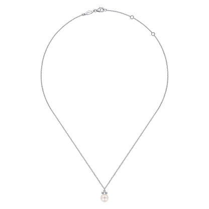 The Gabriel & Co 14K White Gold Diamond and Pearl Pendant Necklace features a round cultured pearl pendant accented by three sparkling diamonds, set on a delicate adjustable chain.
