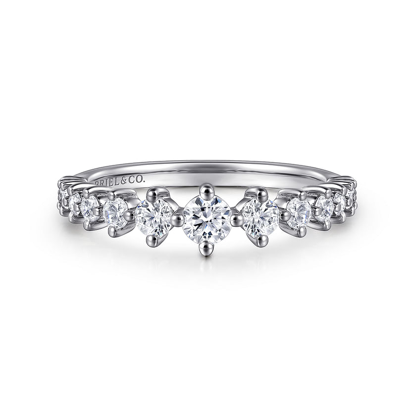 The 14K White Gold Graduating Diamond Classic Ladies Ring by Gabriel & Co features a stackable design with a center diamond and smaller diamonds tapering along the band for an elegant look.